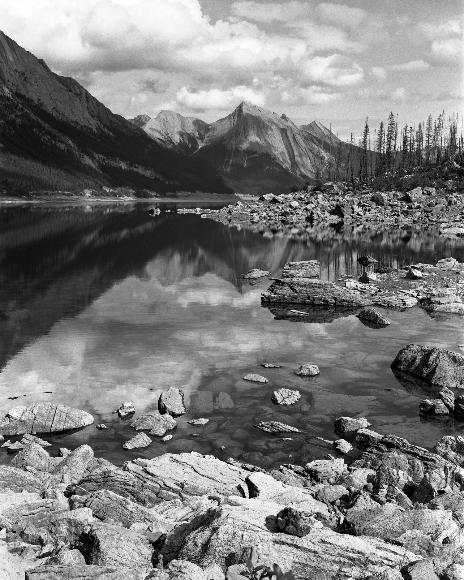 Black and white photograph of a rocky mountain lake